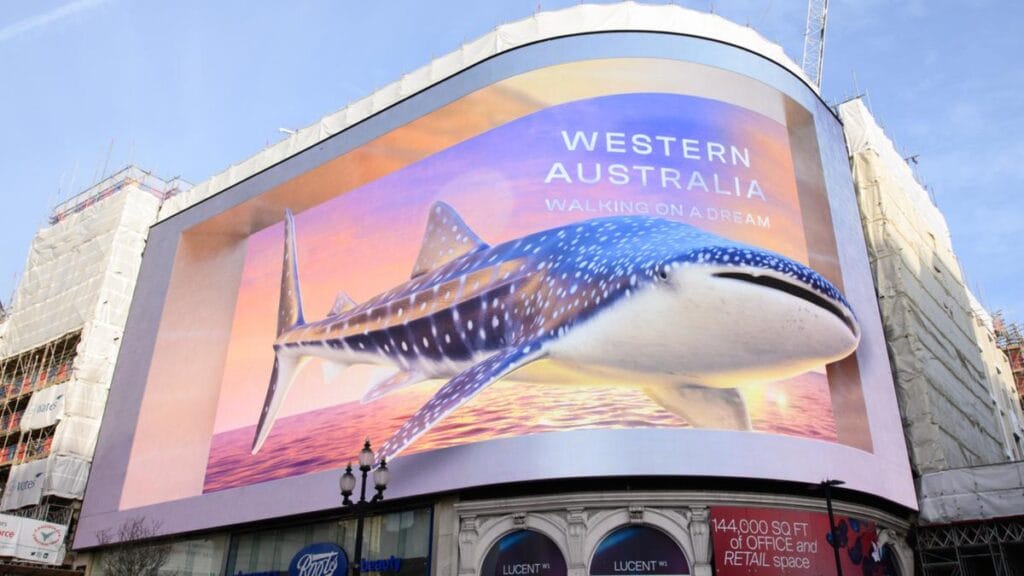 Australian tourism walking on a dream whale shark 3D billboard in London